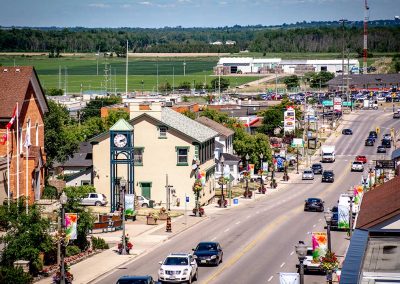 photo of a main street in downtown BWG showing shops and traffic