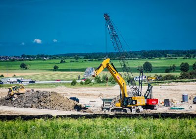 digger machine moving dirt on construction site